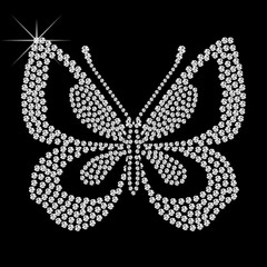 Butterfly of diamonds. Beautiful pattern embroidery of flying diamond butterfly. Shiny, silver and black print with diamonds, embroidery and jewelry. Isolated fashion abstract background.