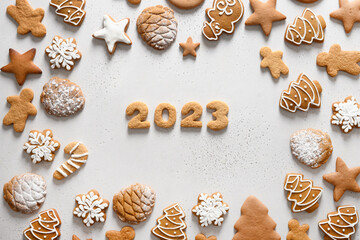 Christmas handmade glazed cookies with date 2023 inside on white background. View from above. Happy...