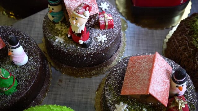 Santa claus snowman cakes. Cakes on the table.