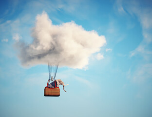 Elephant flying with hot air balloon .