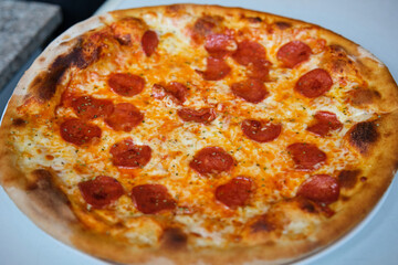 Freshly baked pepperoni pizza. Pizzeria.