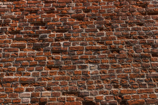 An Old Wall Of Red, Uneven Bricks