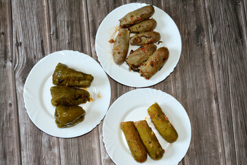 Stuffed squash zucchini Mahshi, eggplants, wrapped grape leaves and bell peppers filled with white...
