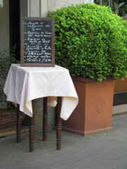 outdoors Italian restaurante menu billboard.