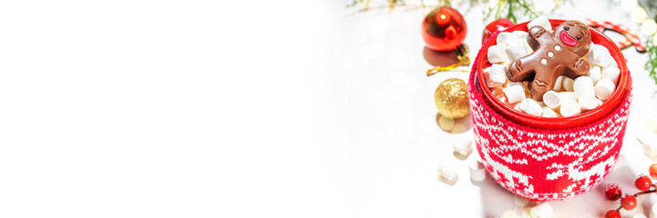 Christmas hot chocolate mug with funny cute gingerbread man made from chocolate, bathing playing in...