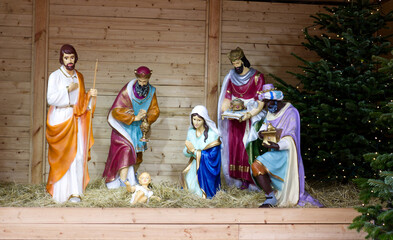 Traditional christmas nativity scene with baby Jesus Christ, Mary, Joseph and three Magi