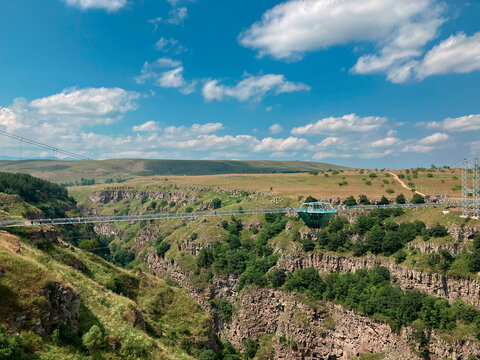 Dashbashi, Georgia - Diamond cafe on glass bridge over scenic valley in Georgia countryside. Famous modern bridge over the valley