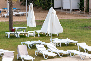 Sunbeds and deck chairs by the pool.