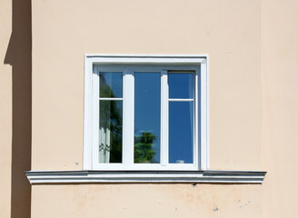Window in the wall of the house.