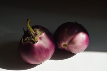 round purple eggplant. a ripe vegetable. vegetarian food. background for the design.