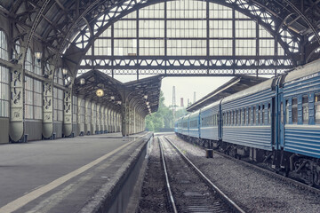 Train stands by the platform.