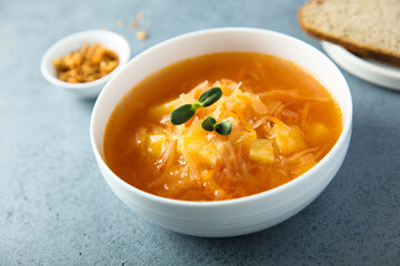 Traditional homemade sauerkraut soup with fresh parsley