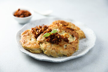 Homemade potato pancakes with red pesto
