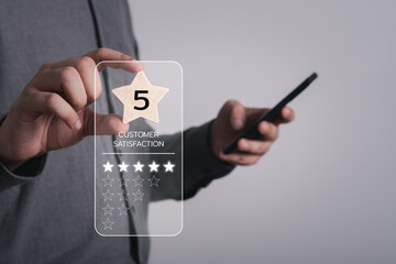 Close up of man customer giving a five star rating on smartphone. Using technology for Review, Service rating, satisfaction, Customer service experience and satisfaction survey concept.