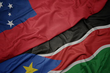 waving colorful flag of south sudan and national flag of Samoa .
