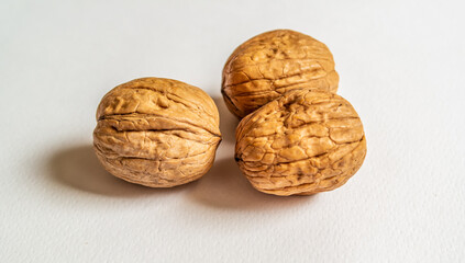 Background with three Italian walnuts