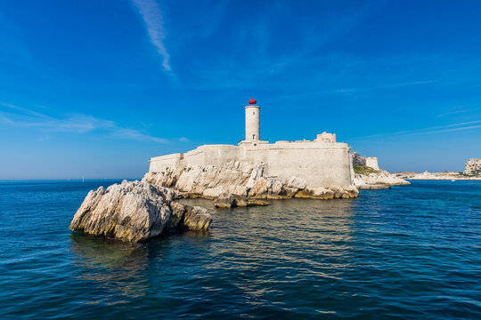 Chateau d'If castle lighthouse seen from a boat in the Frioul archipelago offshore from Marseille, France