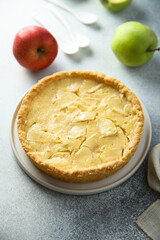 Traditional homemade apple pie with vanilla cream