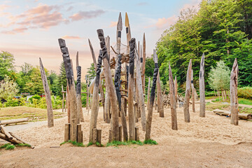 A children's playground with spears and logs in the style of the prehistoric Stone Age in the...