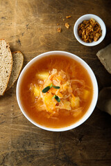 Traditional homemade sauerkraut soup with fresh parsley