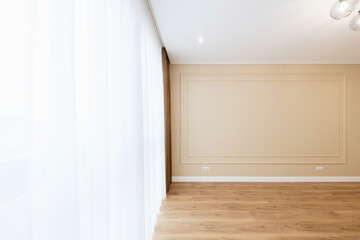 Interior design of a room with light walls and a window. empty and clean