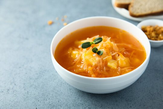 Traditional homemade sauerkraut soup with fresh parsley