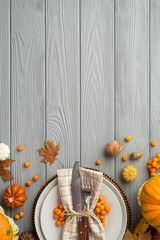 Thanksgiving day concept. Top view vertical photo of plate knife fork napkin maple leaves raw...