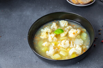 cauliflower soup broth vegetables fresh dish healthy meal food snack diet on the table copy space food background rustic top view keto or paleo diet veggie vegan or vegetarian food