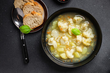 cauliflower soup broth vegetables fresh dish healthy meal food snack diet on the table copy space food background rustic top view keto or paleo diet veggie vegan or vegetarian food