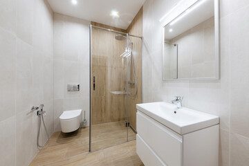 Fototapeta na wymiar Tile bathroom interior design. Bath and sink for washing