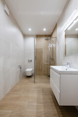 Fototapeta na wymiar Tile bathroom interior design. Bath and sink for washing