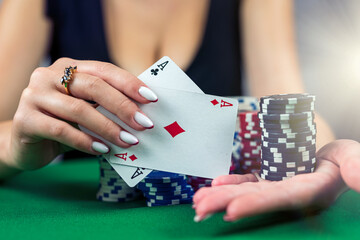 beautiful woman with poker cards is playing low in poker.