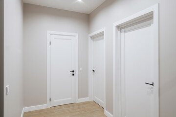 Interior design of a bright corridor with stylish furniture. Cleanliness and order