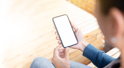cell phone blank white screen mockup.hand holding texting using mobile on desk at office.background empty space for advertise.work people contact marketing business,technology
