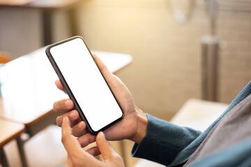 cell phone blank white screen mockup.hand holding texting using mobile on desk at office.background empty space for advertise.work people contact marketing business,technology