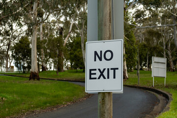 Road sign No Exit plate black on white in the park in Australia