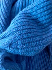 Knitting sweater on close up view 