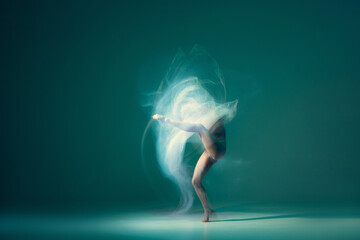 Fototapeta na wymiar Light weightless gait of ballerina similar to smooth movement of a cloud. Art, beauty, aspiration, flexibility, inspiration concept.