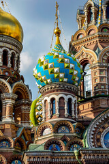 Fototapeta na wymiar T owers and domes of famous and colorful church of the Saviour on Spilled Blood in Saint Petersburg, Russia
