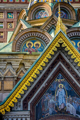 Fototapeta na wymiar Details of the facade and frescoes of the famous and colorful church of the Saviour on Spilled Blood in Saint Petersburg, Russia