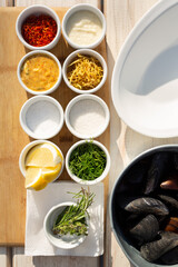 Ingredients for cooking fresh mussels.