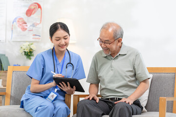 Asian female doctor who works in an office and consults to patient explains health care symptoms...