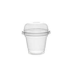 Disposable clear plastic cup standing in isolated environment
