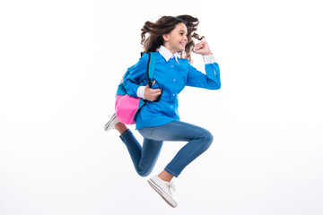 Schoolgirl in school uniform with school bag. Run and jump. Schoolchild, teen student hold backpack on white isolated background.
