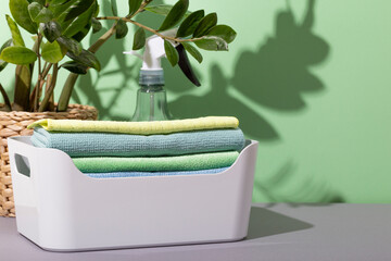 Microfiber cloths for cleaning in a box and a spray bottle with clean water. Tools for eco friendly...