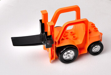 Children's toy front loader on a white background close-up