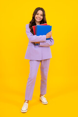 Schoolgirl with copy book posing on isolated background. Literature lesson, grammar school. Intellectual child reader.