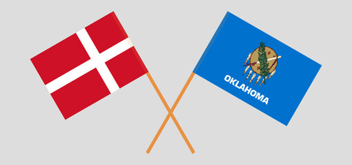 Crossed flags of Denmark and The State of Oklahoma. Official colors. Correct proportion
