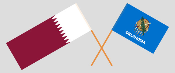 Crossed flags of Qatar and The State of Oklahoma. Official colors. Correct proportion