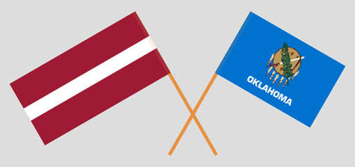 Crossed flags of Latvia and The State of Oklahoma. Official colors. Correct proportion